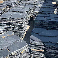 Naturally textured irregular slate paving stones in landscape setting