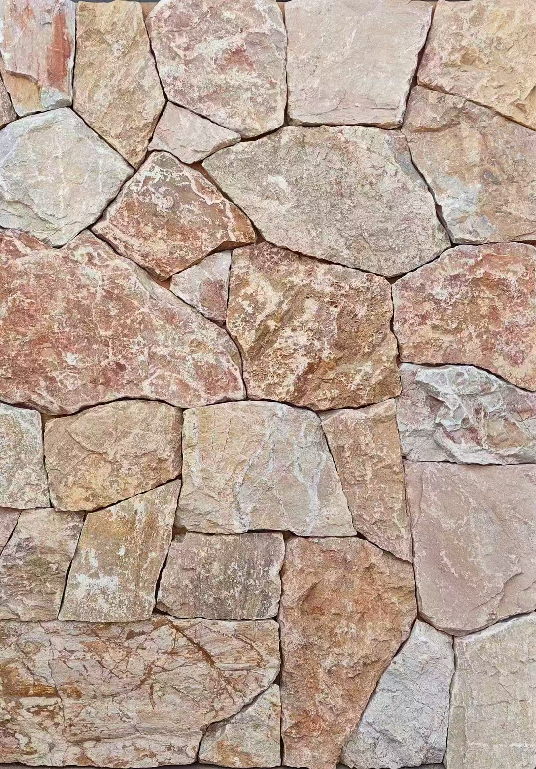 Naturally textured irregular slate paving stones in landscape setting