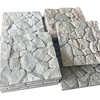 Naturally textured irregular slate paving stones in landscape setting