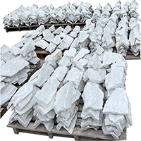 Naturally textured irregular slate paving stones in landscape setting