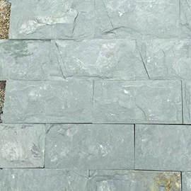 Hand-split mushroom slate stone showing organic texture and iron oxide veining - quarry direct pricing